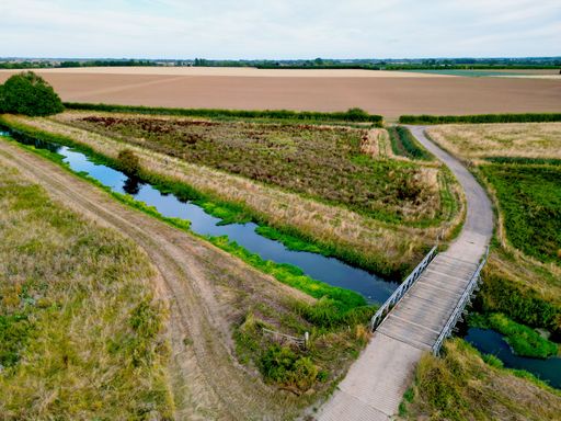 An aerial shot of a crossing bridge on the River Stour in England.