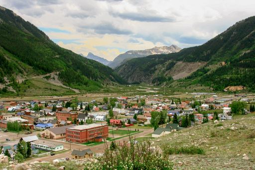 A small town nestled in a valley in the Rocky Mountains.