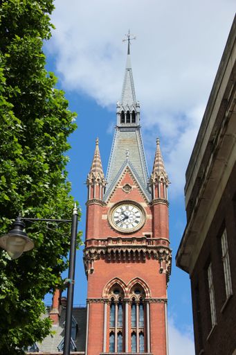 A vertical shot of the St Pancras Renaissance Hotel clock