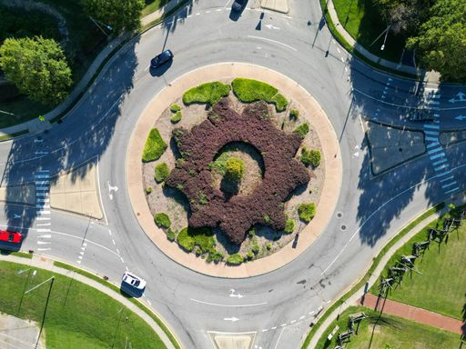 An aerial top view of the roundabout traffic circle in the summer in North Carolina
