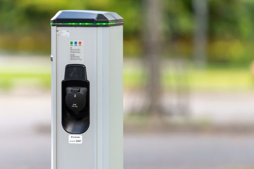 Charging station for electric cars, loading batteries. Concept for eco friendly and green future. Blurred background, place for text and copy space.