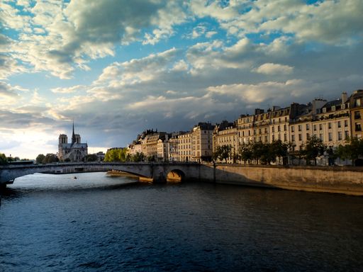 A breathtaking shot of the river Seine in Paris and the Notre Dame cathedral in the background