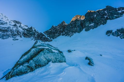 A breathtaking view of the magnificent mountains covered in snow under the blue sky in Slovakia