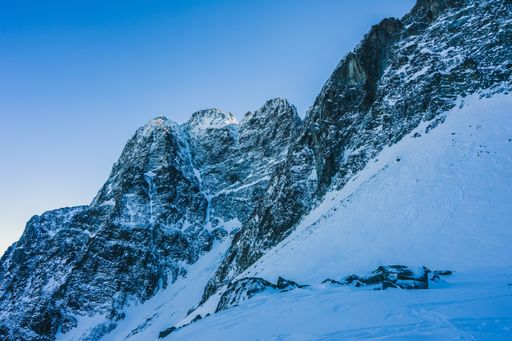 A breathtaking view of the magnificent mountains covered in snow under the blue sky in Slovakia