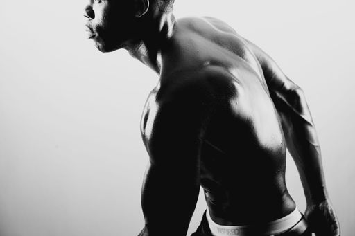 Black male monochrome portrait in the studio.
