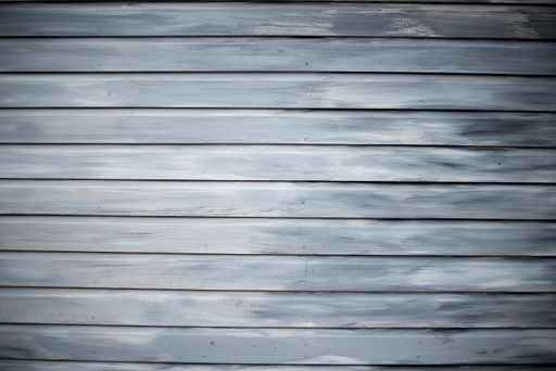 A grayscale shot of a wall made of horizontal wooden planks - perfect for cool wallpaper background