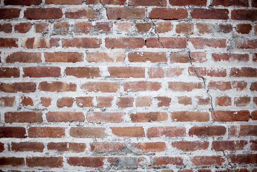 A closeup shot of a stacked stone wall - perfect for a cool background wallpaper