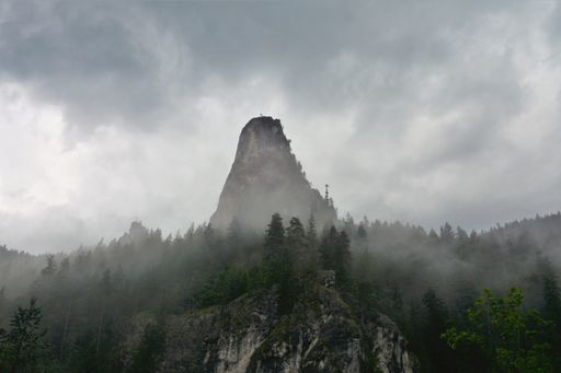 A beautiful shot of the altar stone of Bicaz gorge partially covered with fog