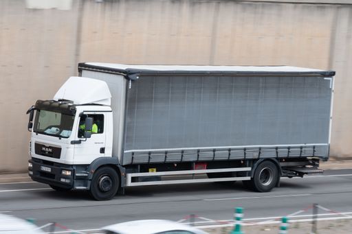 A white Man TGM truck on road