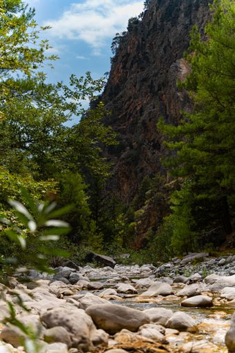 A vertical shot of the Samaria Gorge near Lakki, Crete, a small river running through