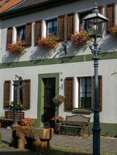 A vertical shot of a historical house front in Krefeld-Linn, Germany
