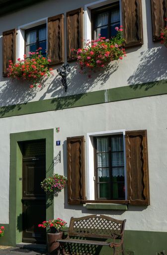 A house with flowers on the windowsills in Krefeld-Linn, Germany