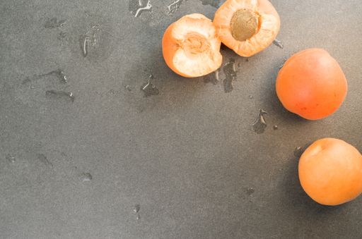 A top view shot of plums on a smooth surface