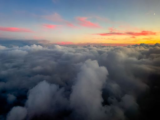 An aerial view of sunset through airliner window