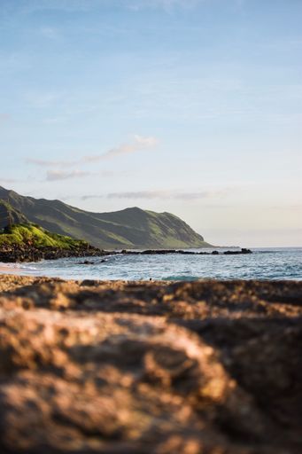 A vertical of a mountain on the beach in Oahu, Hawaii.