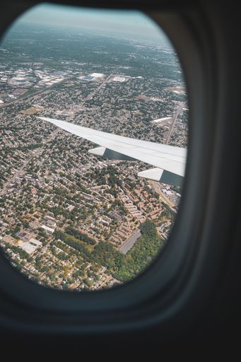 A aerial view on city out of window of a plane