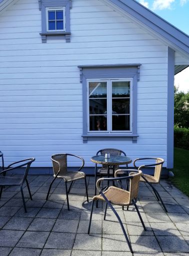 A vertical shot of patio of a house from the village of Gjeving, Norway