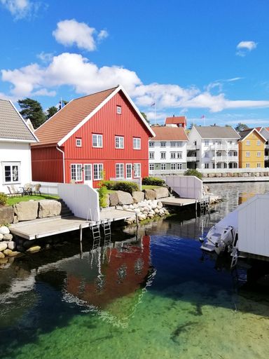 A vertical shot of the houses near the sea from the village of Gjeving, Norway