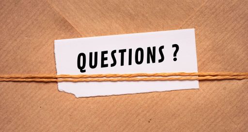 Close up conceptual shot of a business idea showing Questions