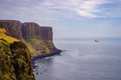A scenic view of the coastline near Portree on the Isle of Skye in Scotland, UK