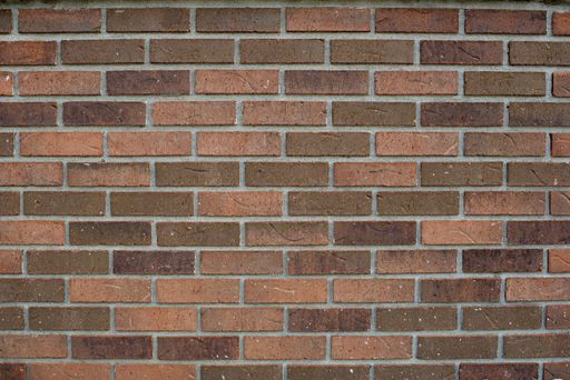 A closeup shot of a red brick wall - perfect for a cool background wallpaper