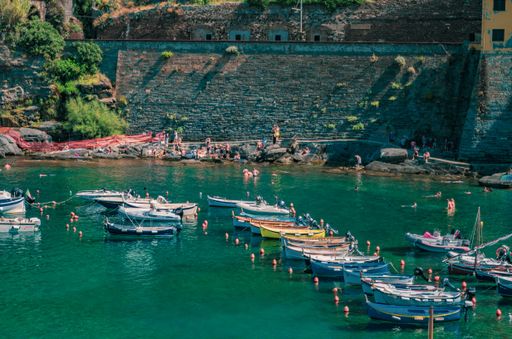 Boats and sea near mountains in LIguria, Italy
