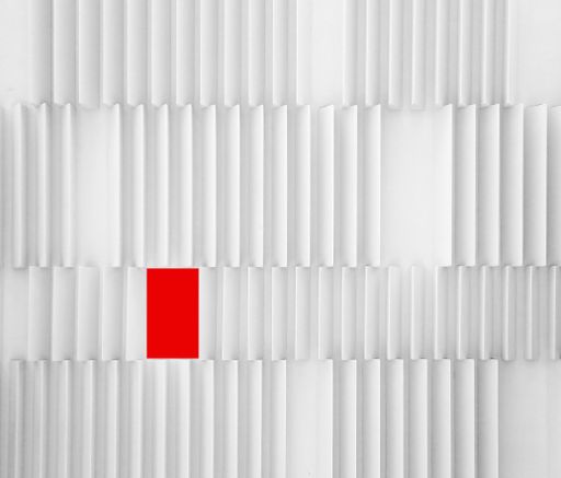 A beautiful minimalistic design of a modern futuristic white wall with a red rectangle giving it a diverse, out of the box feel