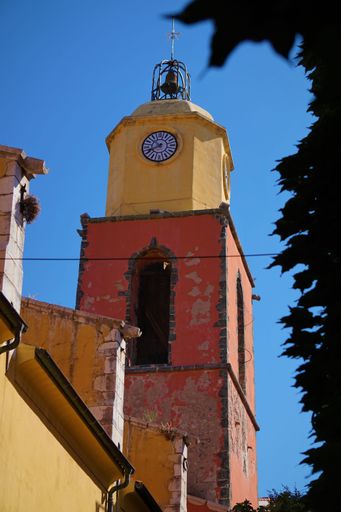 A vertical view of the clock tower and church bell of Saint-Tropez