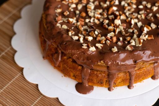 A top view of Snickers cake decorated with peanuts