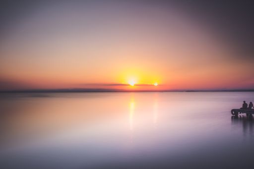 An amazing shot of a reflective sea during a sunset