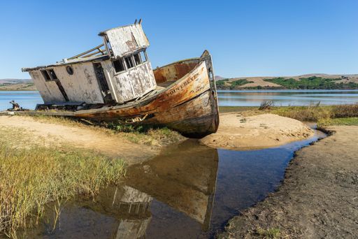 A closeup of an old rusty ship in Tomales Bay in California