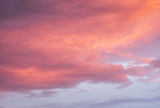A beautiful shot of the sky filled with clouds during an orange sunset