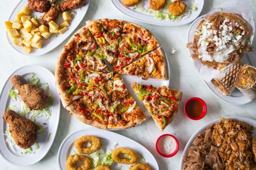 A top view of variety of Pakistani fast food dishes