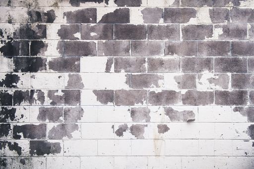 A cool background image of an old white and gray brick wall