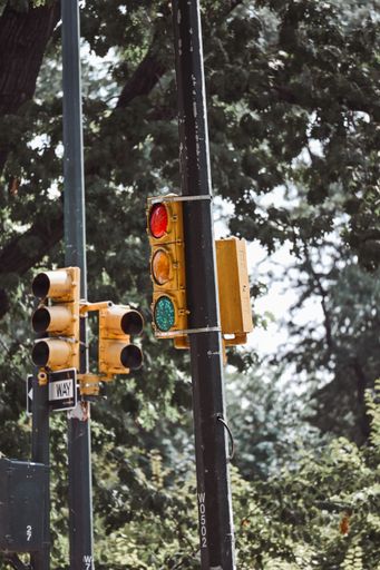 A vertical shot of street sign traffic lights