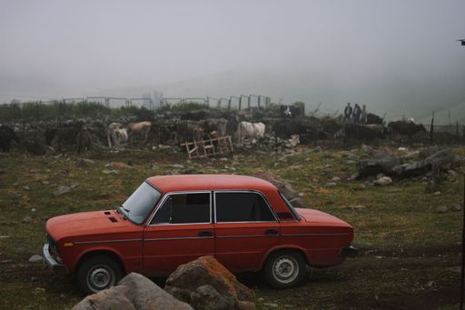 A red Lada Vaz 2103 in a rural area of Verishen village, Syunik Province, Armenia