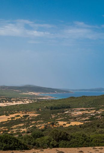 A vertical aerial view of a beautiful seashore with a rocky cliff in Kef Abbed, Tunisia