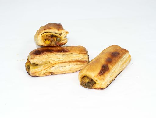A closeup shot of Baked Vegetable Puff Samosa isolated on the white background