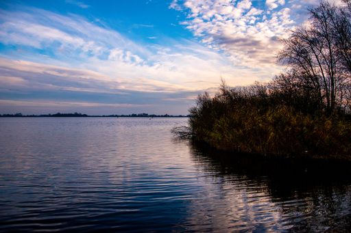 A beautiful shot of a wide lake during sunset