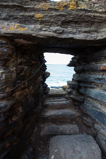 a vertical shot of the ocean through a sea cave