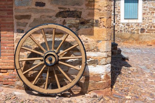A closeup of a wagon wheel in Castrillo de los Polvazares, in province of Leon