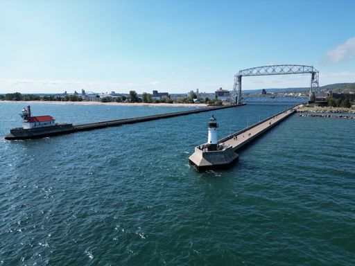 An aerial Lift Bridge with lighthouses at end of piers
