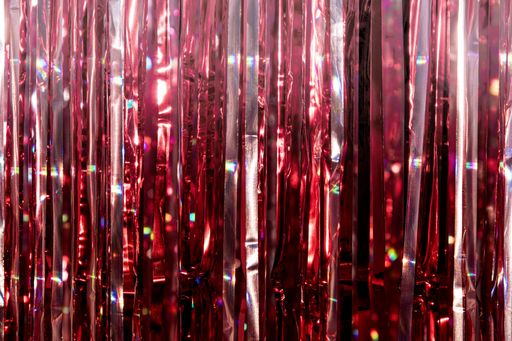 A closeup shot of red foil curtain for decorations