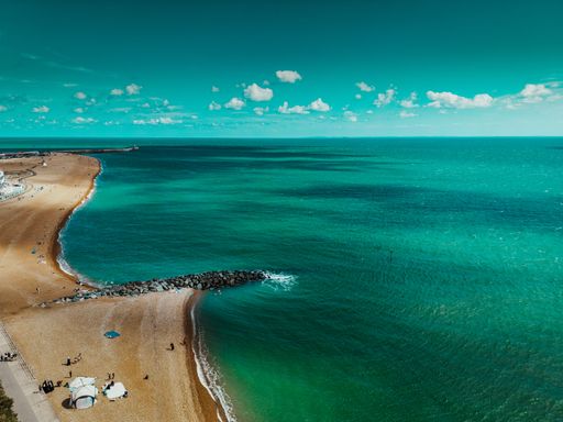 An aerial view of a beautiful beach near Leas Cliff Hall in Folkestone, United Kingdom