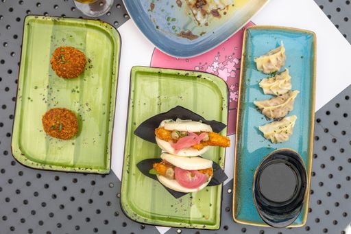 A top view of different types of traditional Asian dishes served at a local Asian restaurant
