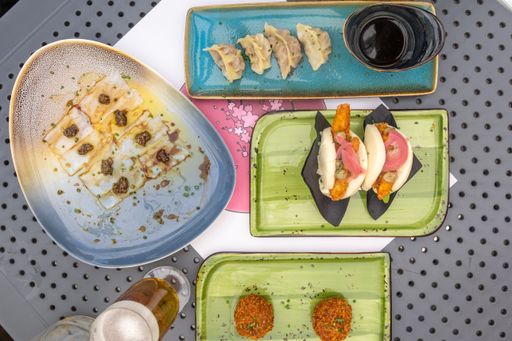 A top view of different types of traditional Asian dishes served at a local Asian restaurant
