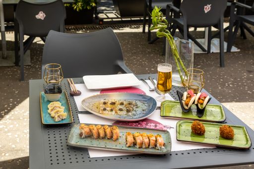 A high-angle shot of different types of traditional Asian dishes served at a local Asian restaurant