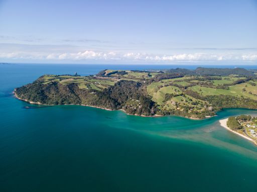 An aerial view of the sea and Cooks Beach, Coromandel Peninsula in New Zealand's North Island