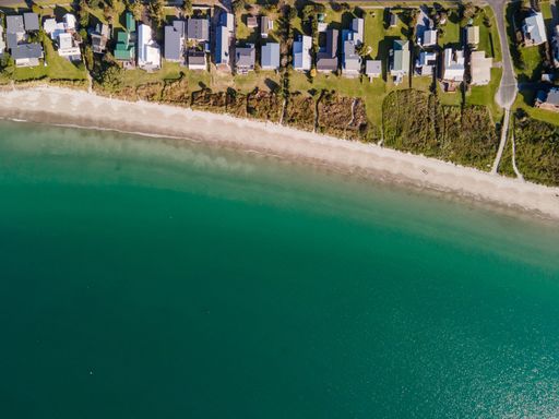 An aerial view of the sea and Cooks Beach, Coromandel Peninsula in New Zealand's North Island