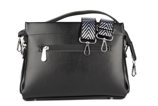 Black faux leather women's handbag isolated on white background. Copy space.